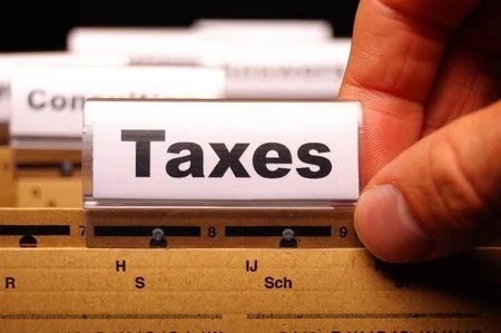 Stock photo of file folders with one marked Taxes. STORY: Duterte tax proposals seen to hit poor, middle class