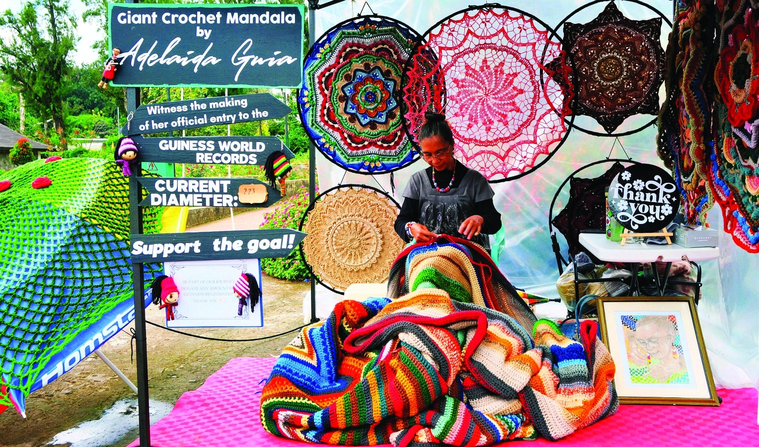 PARKATTRACTION Baguio-based crochet artist Adelaida Guia has been creating a 223-inch diameter mandala she calls “The Wishing Star” in full viewof residents and tourists who have been visiting Burnham Park’s Rose Garden since May. Originally from Manila, Guia drew the spotlight during the COVID-19 pandemic when she put giant mandalas on display for a street bazaar on Session Road.