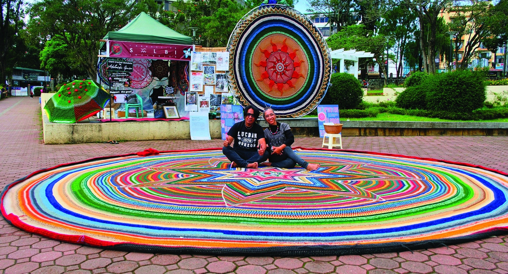 With the full support of husband Philip and their five children, Guia is pursuing a Guinness World Record for huge mandalas crocheted by a single individual.
