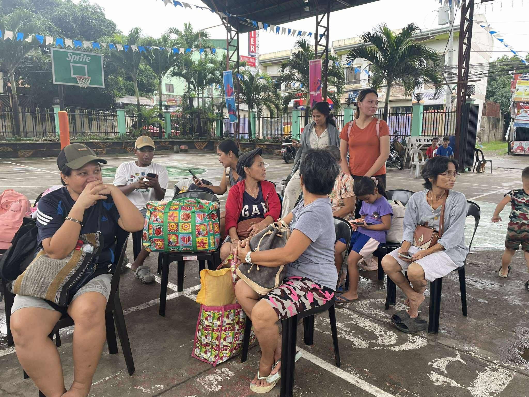 Families await intake interview by social workers in an evacuation center in Zamboanga City on Saturday, June 7, 2025.